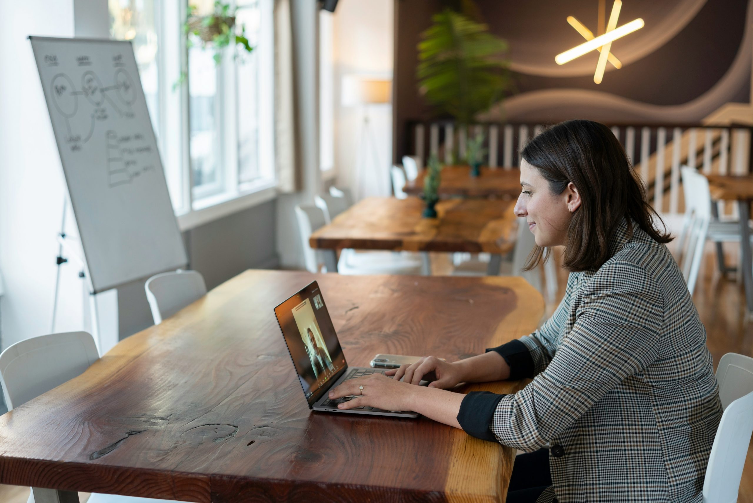 a woman on a laptop during a meeting with a recruitment agency